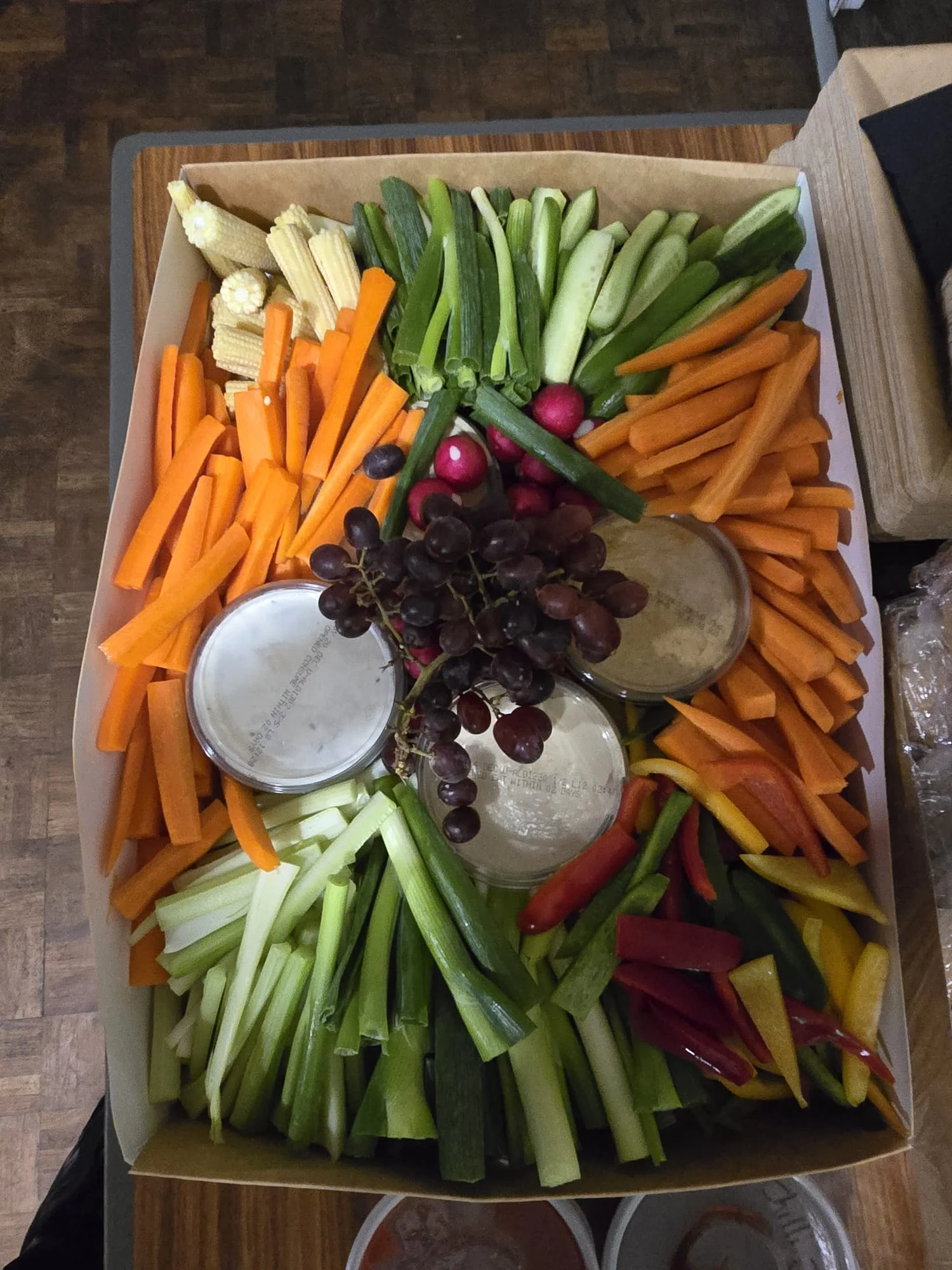 Stuffed peppers with rice and vegetables in a catering tray