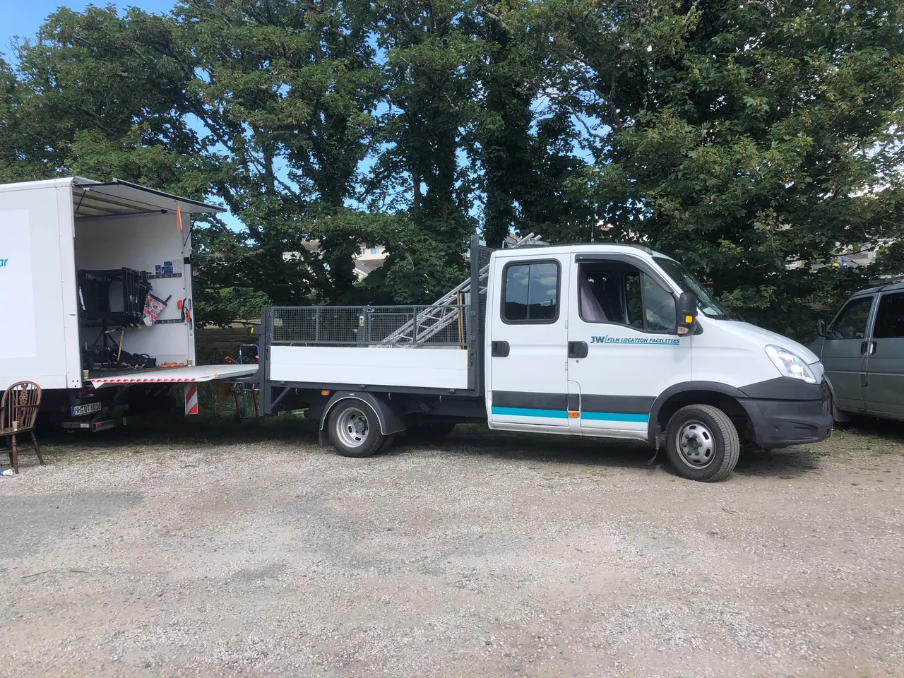 JW Film Facilities crew shuttle and facility truck on a Cornwall location