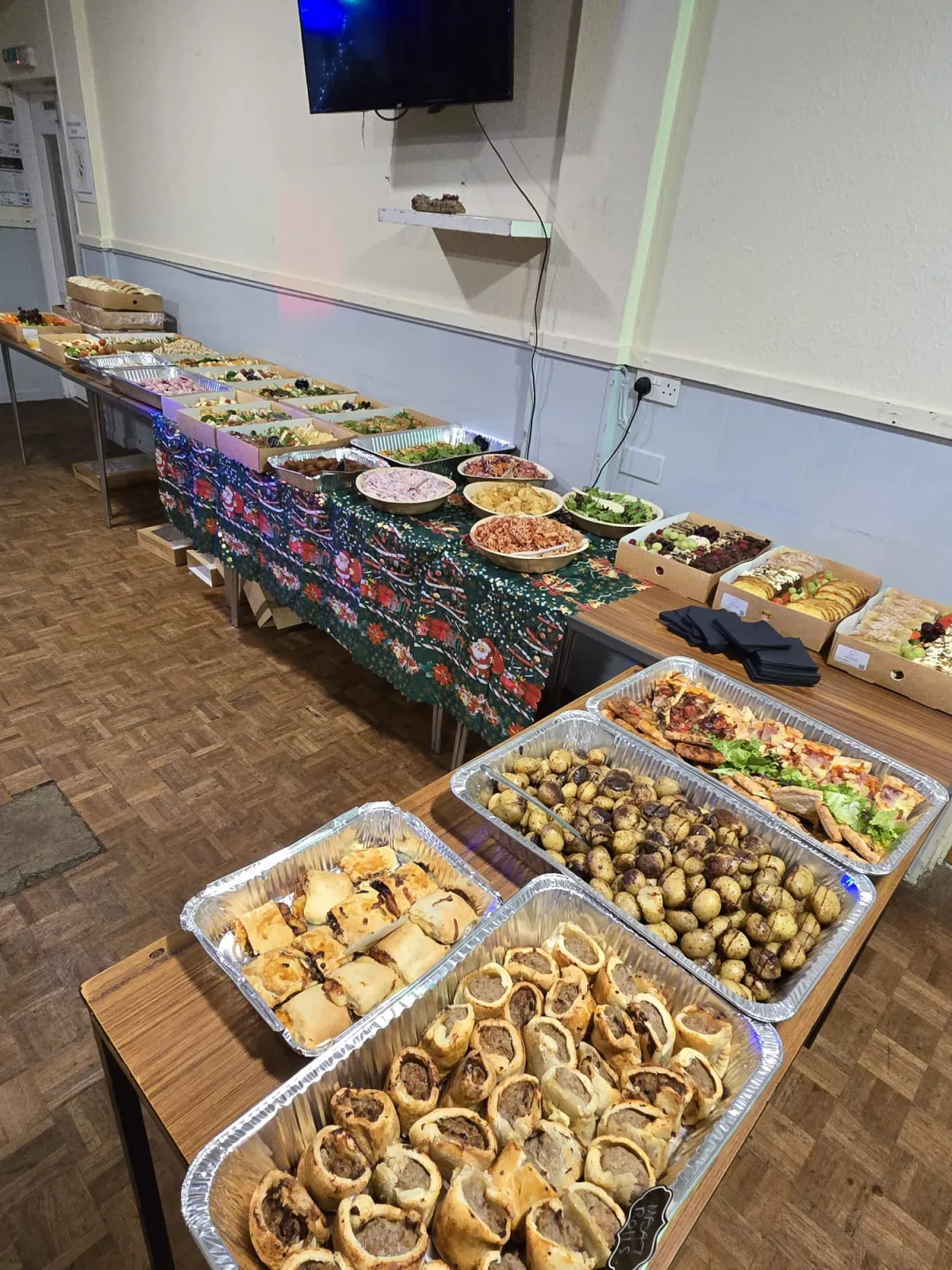 Party food box with sausage rolls, chicken and finger food